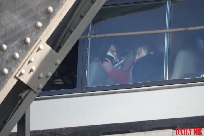 North Korean workers travel on the Sino-Korean Friendship Bridge from Sinuiju to Dandong