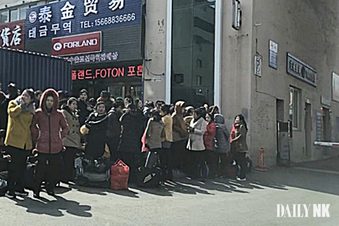 North Korean workers returning to North Korea via the customs office in Dandong in March 2019