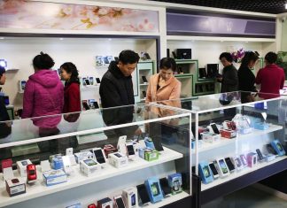 North Korea quietly hikes phone prices at the border North Koreans peruse cell phones on offer