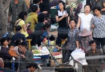 Street market in Hyesan, Ryanggang Province rice sellers dollar rate