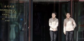 International Women’s Day brings an unusual scene to North Korea: husbands buying lattes Two women standing in front of a coffee shop.