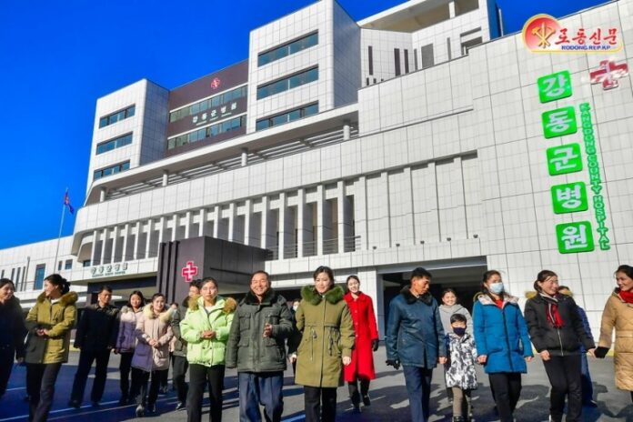 People walking out of the Kangdong County Hospital in Pyongyang.