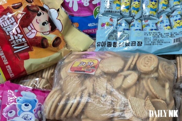 North Korean cookies and candy bags from the Pyongyang Infant Comprehensive Food Factory, bearing Korean-language labeling