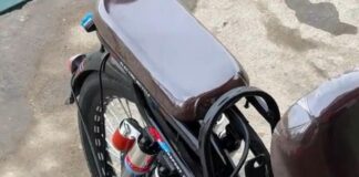 Rear wheel of a North Korean electric bicycle fitted with a shock absorber for load-bearing modifications