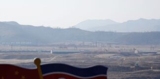 North Korean defectors in China alarmed as Kuaishou messages reach police North Koreans in China forced repatriation: flags near the Tumen River border, North Hamgyong province