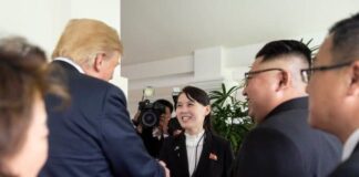 Kim Yo Jong shakes hands with a foreign dignitary at the 2018 Singapore Summit