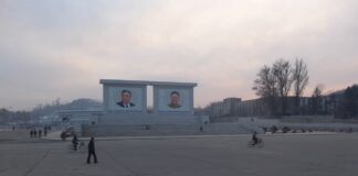 Kim Il Sung and Kim Jong Il portraits on a public square in Sariwon, North Hwanghae province, North Korea