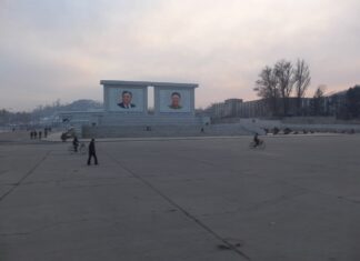 Kim Il Sung and Kim Jong Il portraits on a public square in Sariwon, North Hwanghae province, North Korea