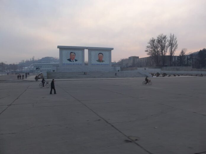 Sariwon,_North_Hwanghae,_North_Korea_-_panoramio_(15) (1) Kim Il Sung and Kim Jong Il portraits on a public square in Sariwon, North Hwanghae province, North Korea