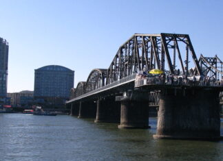 China eyes new trade route linking Dandong and Dalian View of Dandong from the North Korean bank of the Yalu River, with the Yalu River Broken Bridge and Sino-Korean Friendship Bridge visible.