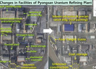 Satellite images from Jan. 21 and April 7, 2026, showing facility changes at North Korea's Pyongsan uranium refinery, including roof repainting, four freight trains, and unknown construction near coal storage