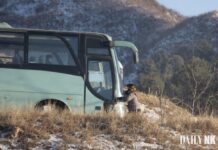 A bus traveling a road in Sakju county, North Pyongan province, near the Amnok River in North Korea