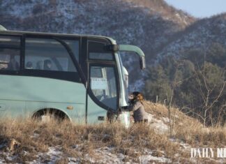 A bus traveling a road in Sakju county, North Pyongan province, near the Amnok River in North Korea