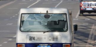 A North Korean vehicle with a North Pyongan province license plate travels on a street in Dandong, Liaoning province, China, in February 2019.