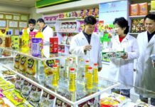 North Korea’s provincial firms need autonomy, not new specifications Workers in white lab coats inspect food products on display at the Amnok River General Food Factory in North Korea.