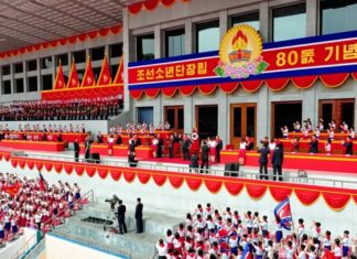 Connections decide North Korea’s top children’s award, parents complain Children's Honor Award ceremony backdrop as Korean Children's Union members celebrate the organization's 80th anniversary with Kim Jong Un