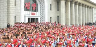 North Korea orders urgent re-vetting of children’s union anniversary delegates Korean Children's Union delegates in red caps and neckerchiefs wave outside Pyongyang Station after arriving for the organization's 80th anniversary celebrations.