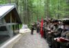 A lecturer addresses a visiting delegation at a revolutionary historic site in North Korea's Mount Paekdu area during a summer tour