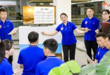 Employees at North Korea's Central Industrial Art Bureau sing songs expressing loyalty to the leader, as reported by Rodong Sinmun on July 8, 2025