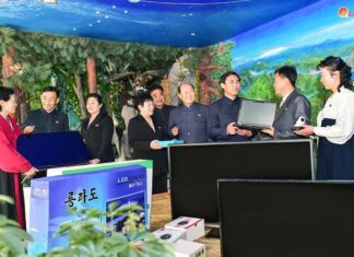 Officials in Chongjin city's Songphyong district, North Hamgyong province, participate in a school support drive during the Month of School Support in March 2024