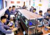 Students and an instructor conduct a hands-on laboratory class at Kim Chaek University of Technology in Pyongyang, as shown in a photo published by Rodong Sinmun in December 2025.