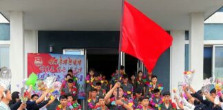 North Korea charges teacher with ‘destruction of state property’ over scratched tablet screen Young volunteers from North Pyongan province depart for construction assignments, carrying a red flag and flower garlands, in a send-off ceremony