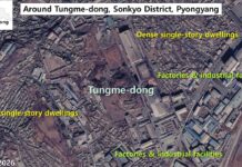 Satellite image of Tungme-dong in Sonkyo District, Pyongyang, showing dense single-story dwellings mixed with factories and industrial facilities, Feb. 6, 2026