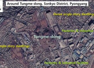 Satellite image of Tungme-dong in Sonkyo District, Pyongyang, showing dense single-story dwellings mixed with factories and industrial facilities, Feb. 6, 2026