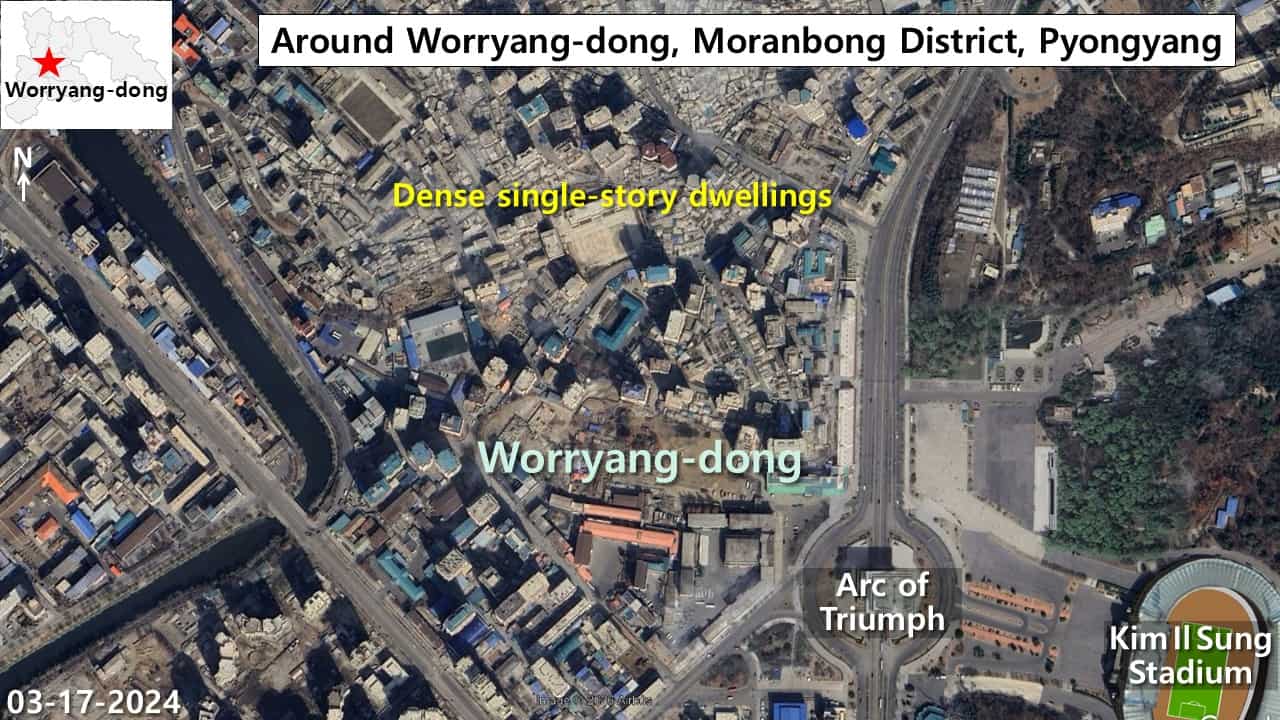 Satellite image of Worryang-dong in Moranbong District, Pyongyang, showing dense single-story dwellings near the Arc of Triumph roundabout and Kim Il Sung Stadium, March 17, 2024