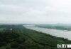 Aerial view of the Tumen River border area where North Korea, China, and Russia converge, with the Tumen River railway bridge visible in the distance