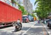 Cargo trucks lined up outside customs in Dandong, China, waiting to cross into Sinuiju, North Korea