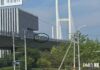 Bus crossing the New Yalu River Bridge toward Sinuiju, North Korea