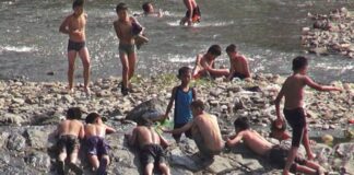 No lifeguards as children swim rivers in North Korea’s summer heat Boys swim and rest along a rocky riverbank on the Yalu River near Hyesan, Ryanggang province