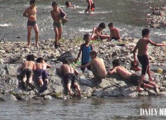 No lifeguards as children swim rivers in North Korea’s summer heat Boys swim and rest along a rocky riverbank on the Yalu River near Hyesan, Ryanggang province