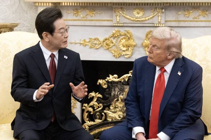 lee-jae-myung-trump-white-house-summit.jpg South Korean President Lee Jae-myung and U.S. President Donald Trump talk in the Oval Office at a 2025 White House summit