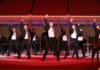 North Korean teens flock to ‘dance tutoring’ inspired by slick pop choreography Young North Korean performers in black and white outfits dance in formation with fists raised on a red stage during the 2026 New Year Celebratory Performance at Rungrado 1st of May Stadium in Pyongyang.