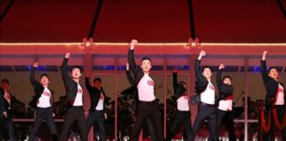 North Korean teens flock to ‘dance tutoring’ inspired by slick pop choreography Young North Korean performers in black and white outfits dance in formation with fists raised on a red stage during the 2026 New Year Celebratory Performance at Rungrado 1st of May Stadium in Pyongyang.