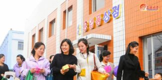 North Hamgyong pushes design contest on factories that already make clothes to order Women carrying shopping bags leave a local industrial factory store in Songchon county, North Korea
