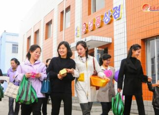 North Hamgyong pushes design contest on factories that already make clothes to order Women carrying shopping bags leave a local industrial factory store in Songchon county, North Korea
