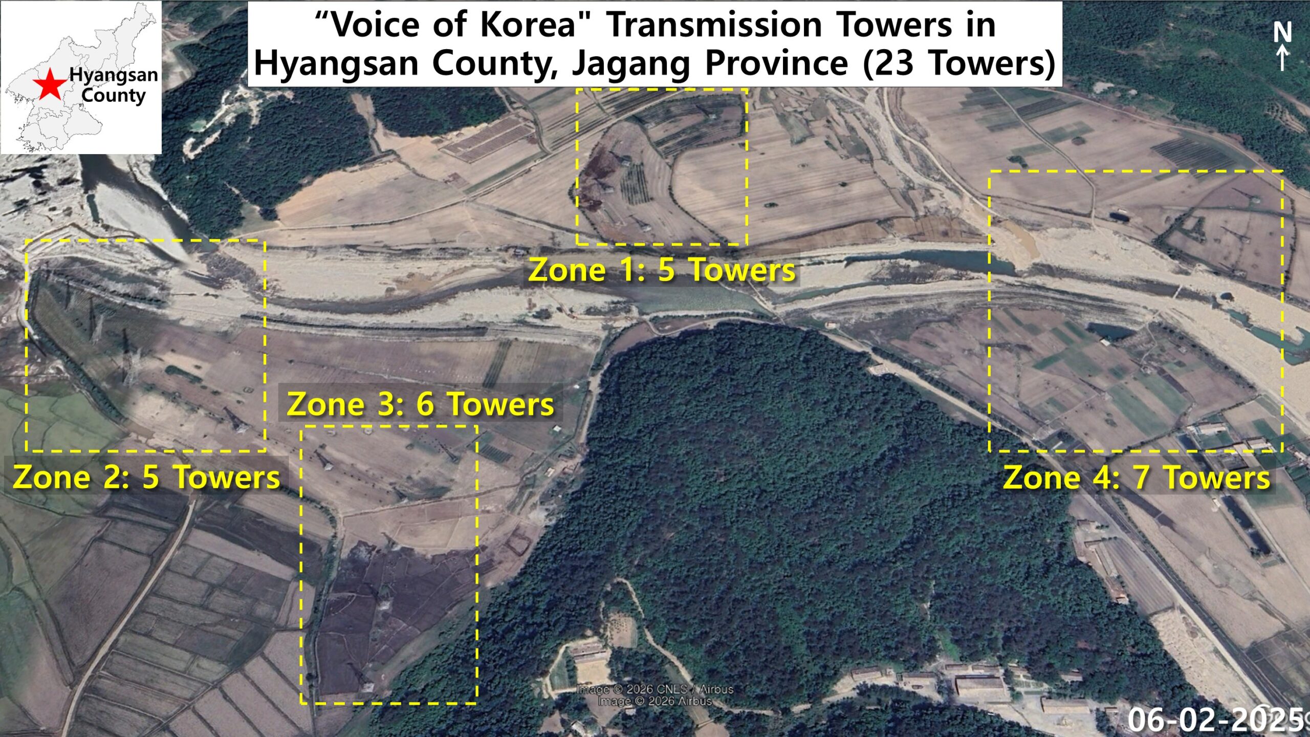 Satellite image of the Voice of Korea shortwave transmitter site in Hyangsan county showing 23 towers in four zones along a river and farmland